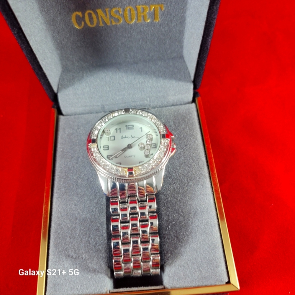 COOKI LEE SILVER TONE WRIST WATCH.